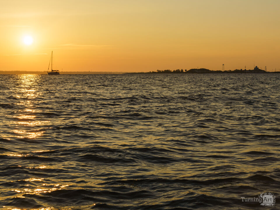 Distant Sail At Golden First Light