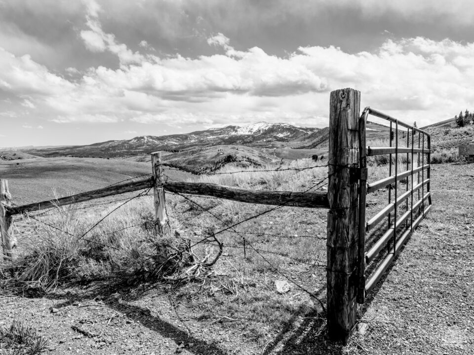 Utah Mountains Behind Fence And Gate Grayscale