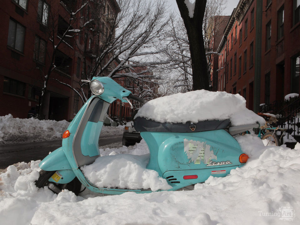 Snow covered scooter