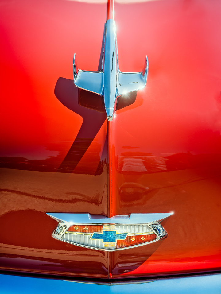 Hood Ornament on a Red 55 Chevy