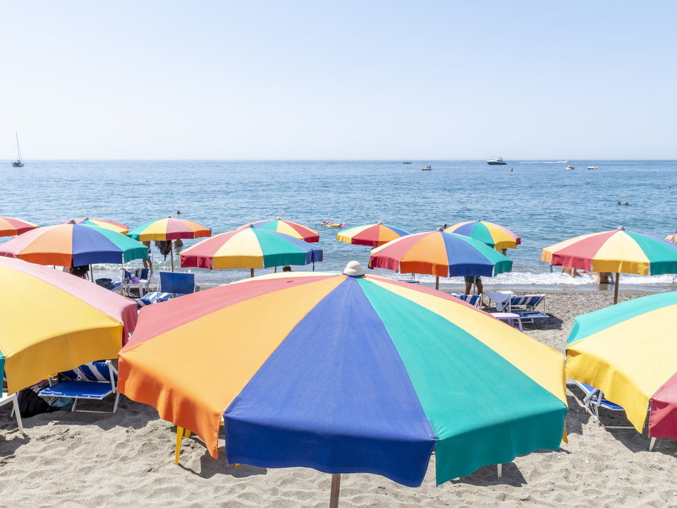 A Rainbow Umbrella on Ischia Beach, Italy