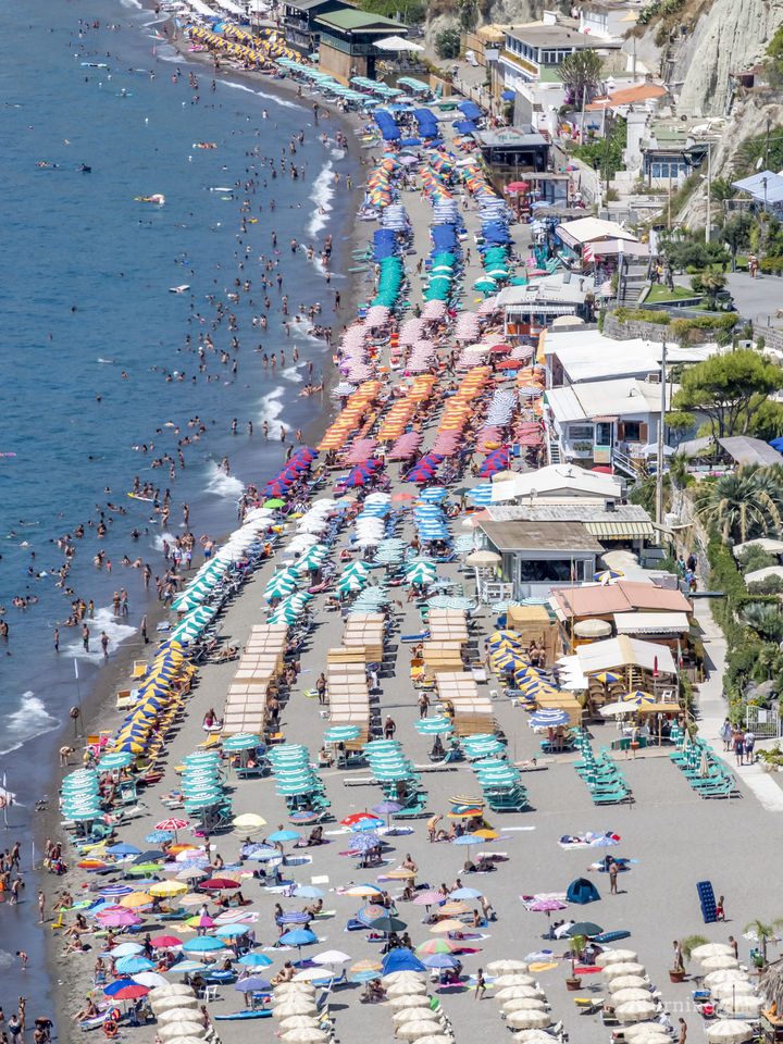 Lines of Umbrellas on Ischia Beach in Italy